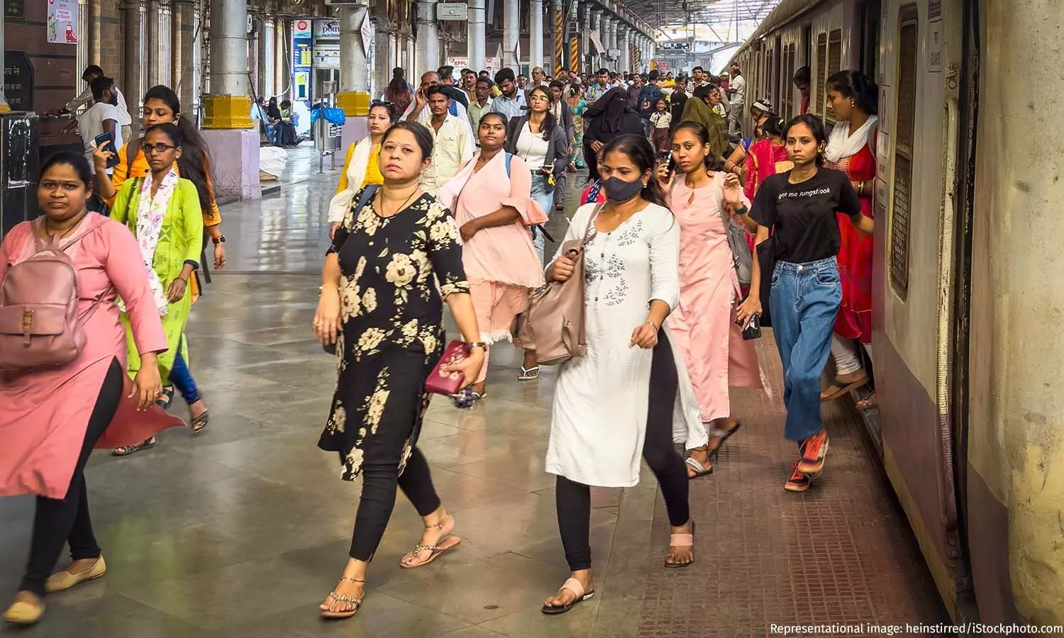 Women in urban india travelling to Work